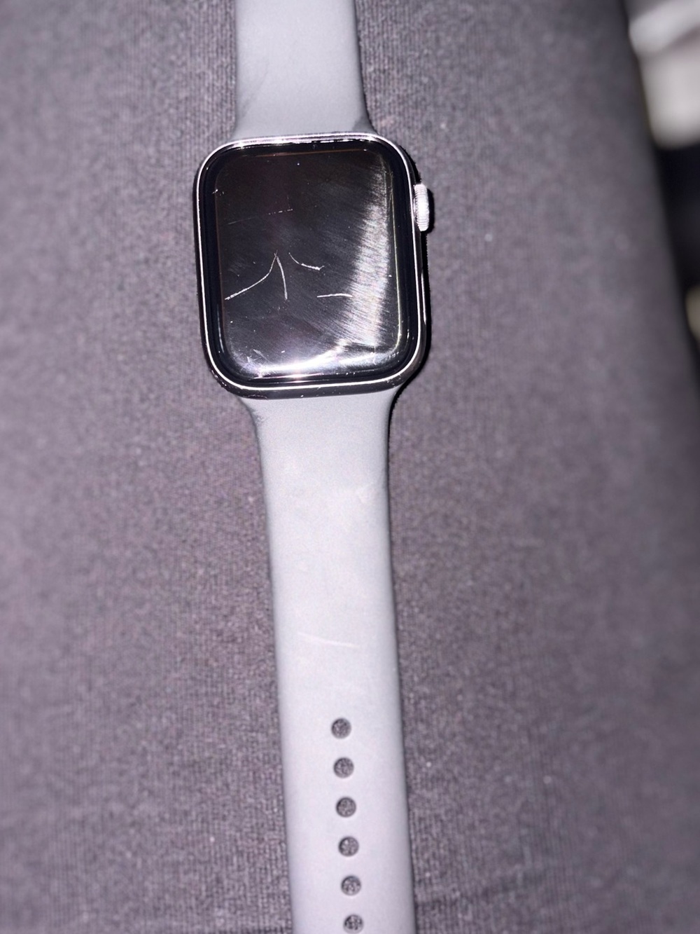 Apple Smartwatch with Light Gray Silicone Band and Silver Case
